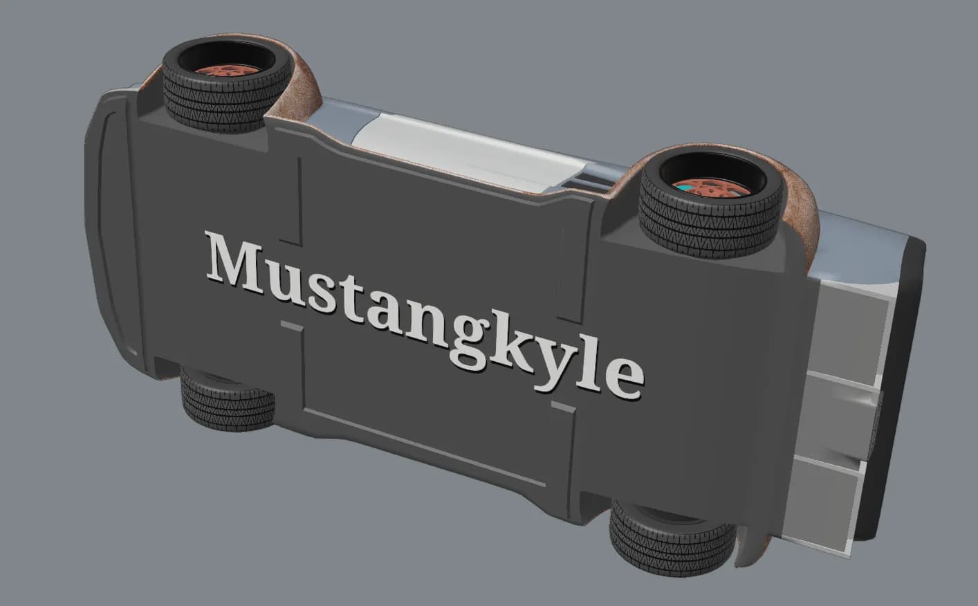 The underside of the Mustang model with the owner's name in raised lettering