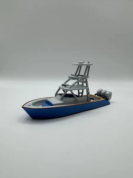 A custom 3D printed sportfish boat model photographed on a clean studio background