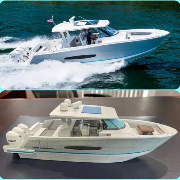 A custom 3D printed boat model compared against the real vessel underway