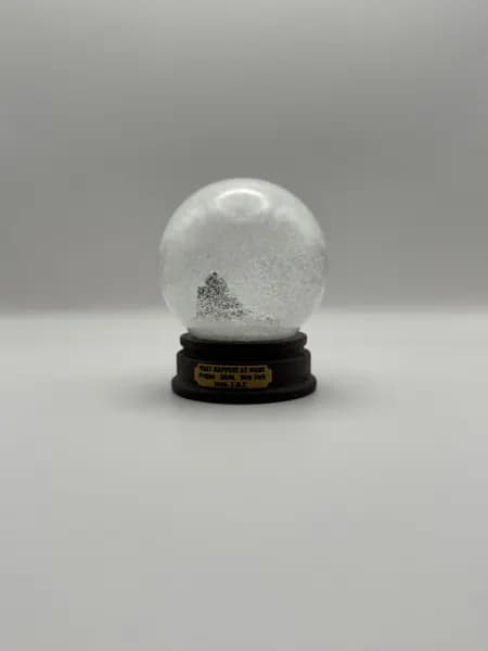 A custom 3D printed snow globe containing a sculpted night-time scene