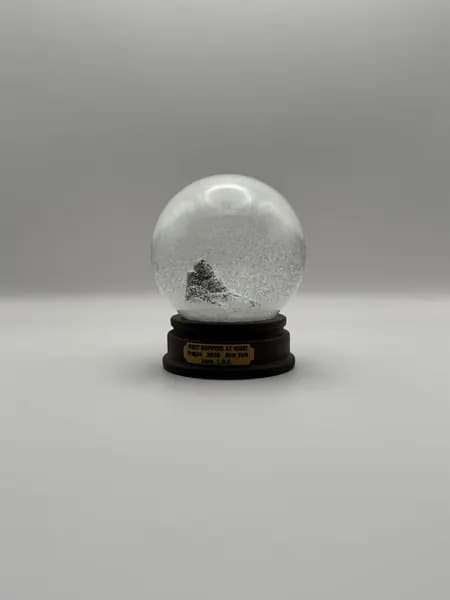 A custom 3D printed snow globe containing a sculpted night-time scene