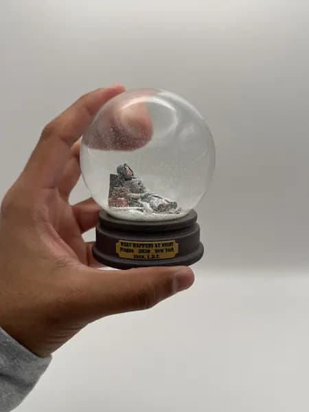 A custom 3D printed snow globe containing a sculpted night-time scene