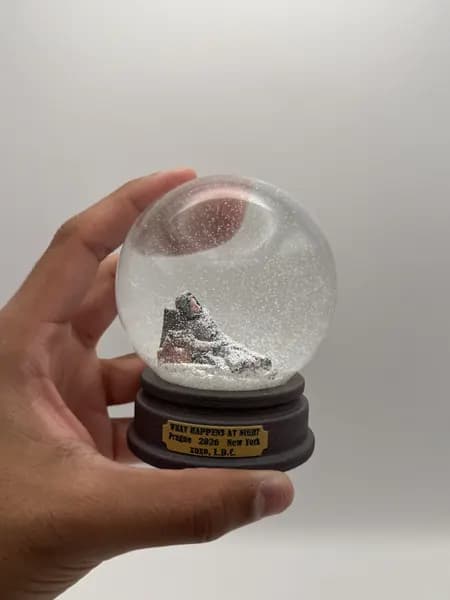 A custom 3D printed snow globe containing a sculpted night-time scene