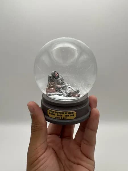 A custom 3D printed snow globe containing a sculpted night-time scene