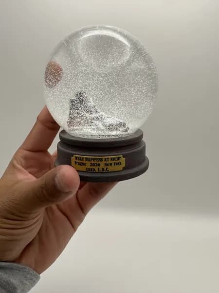 A custom 3D printed snow globe containing a sculpted night-time scene