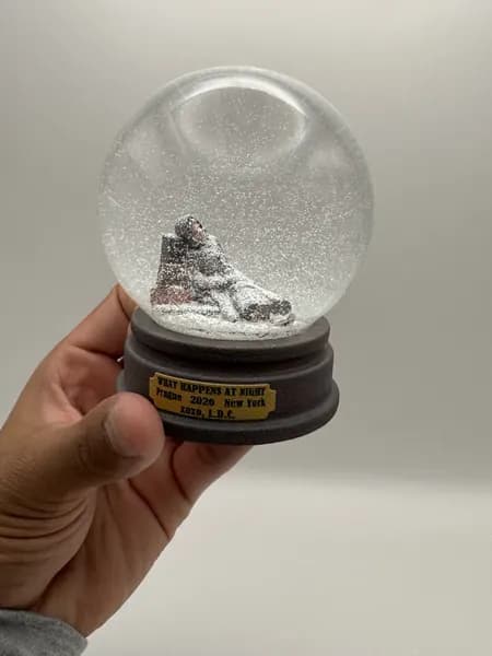 A custom 3D printed snow globe containing a sculpted night-time scene